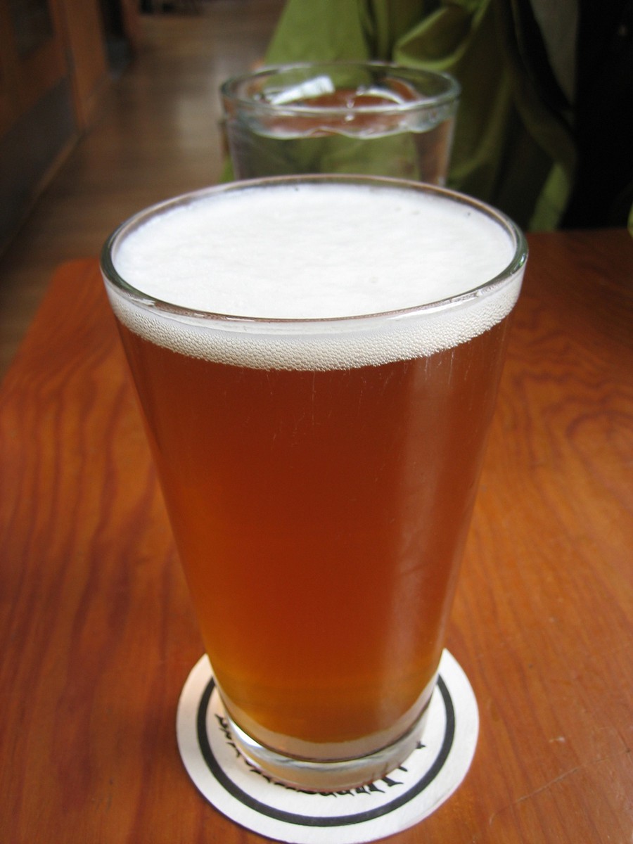 Closeup of a full pint of beer at a brewpub