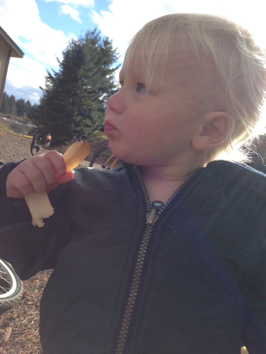 Ada, age 2, eating a french fry at a CCX race