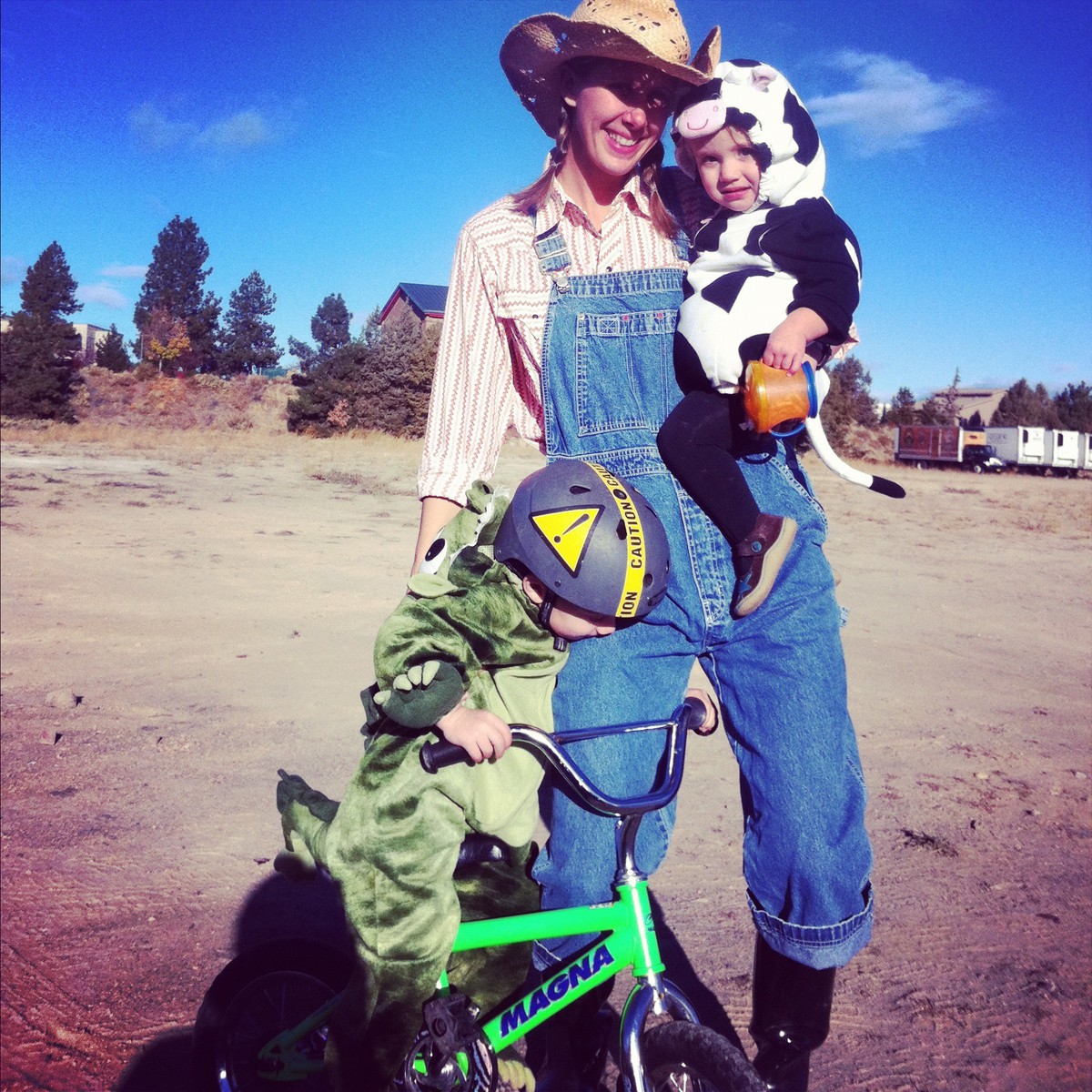 2011: Orion as a dragon, Jenny as a farmer, Iris as a cow