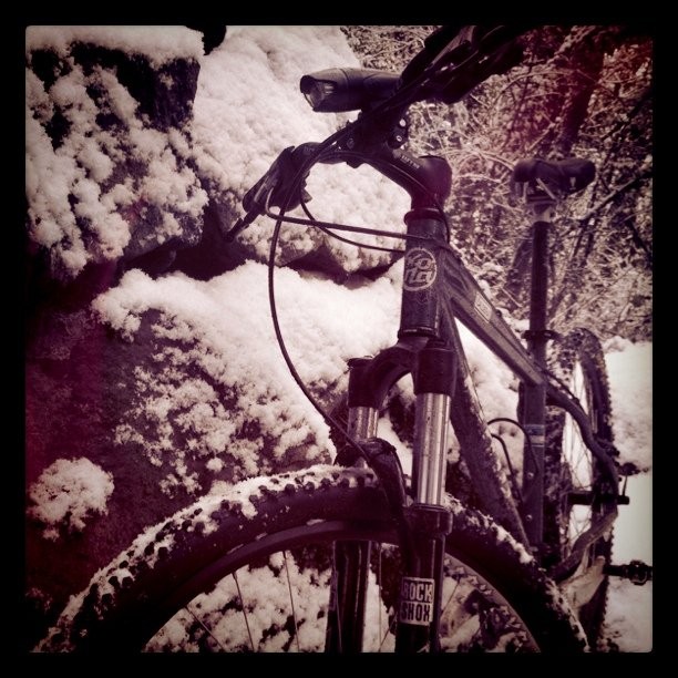 moderate closeup of a mountain bike in the snow