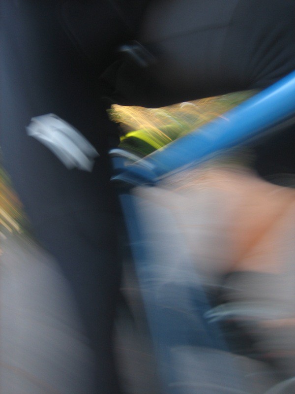 Motion blur closeup of my quads over a racing bicycle