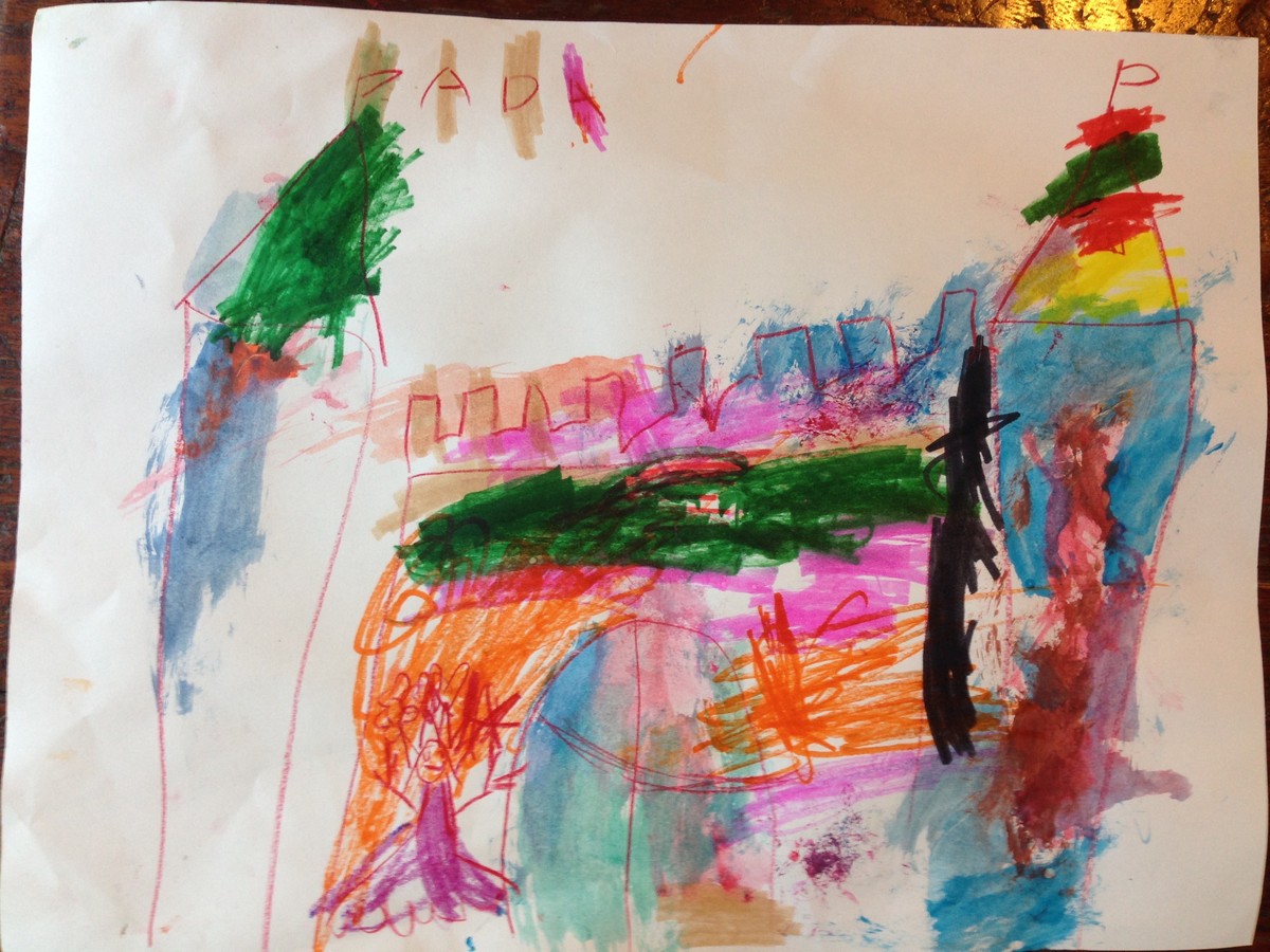 Colorful artwork by a preschooler, in ink and paint, of a castle