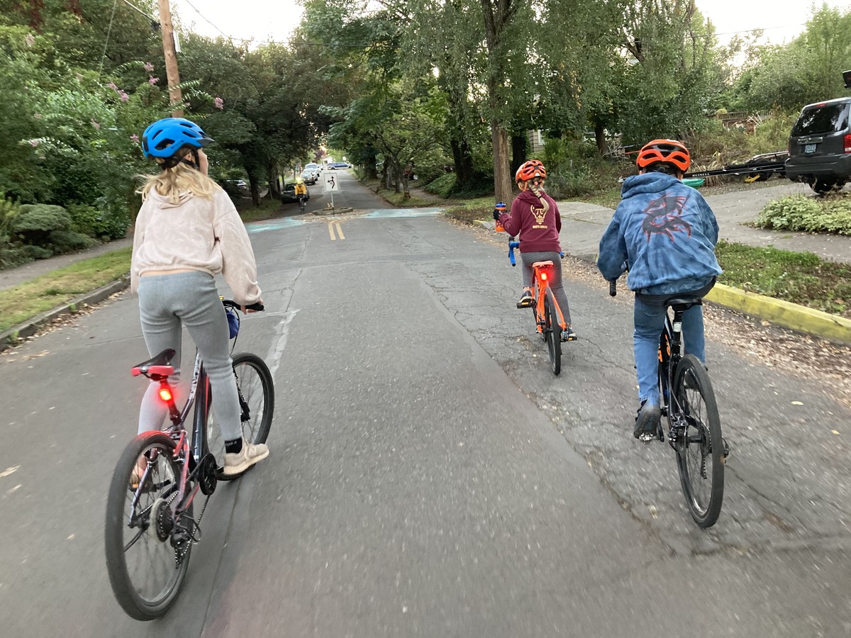 All three kids, elementary school age, on our way to school on a nice spring day