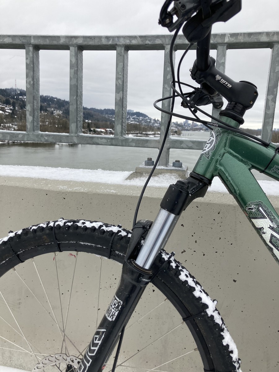 My mountain bike on the Sellwood bridge, with zip-tied tires