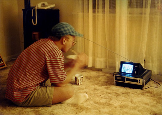 Myself eating cereal in front of a tiny portable TV, taken in 1994