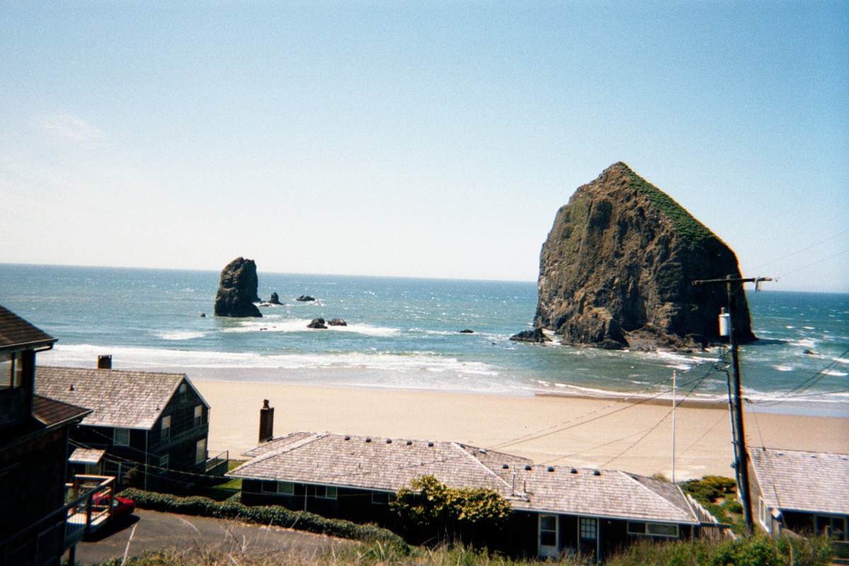 Haystack rock and beach houses on the south end of Cannon Beach