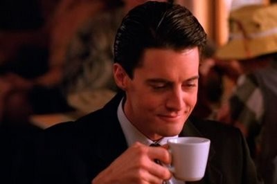 Screenshot from Twin Peaks of Agent Dale Cooper drinking coffee
