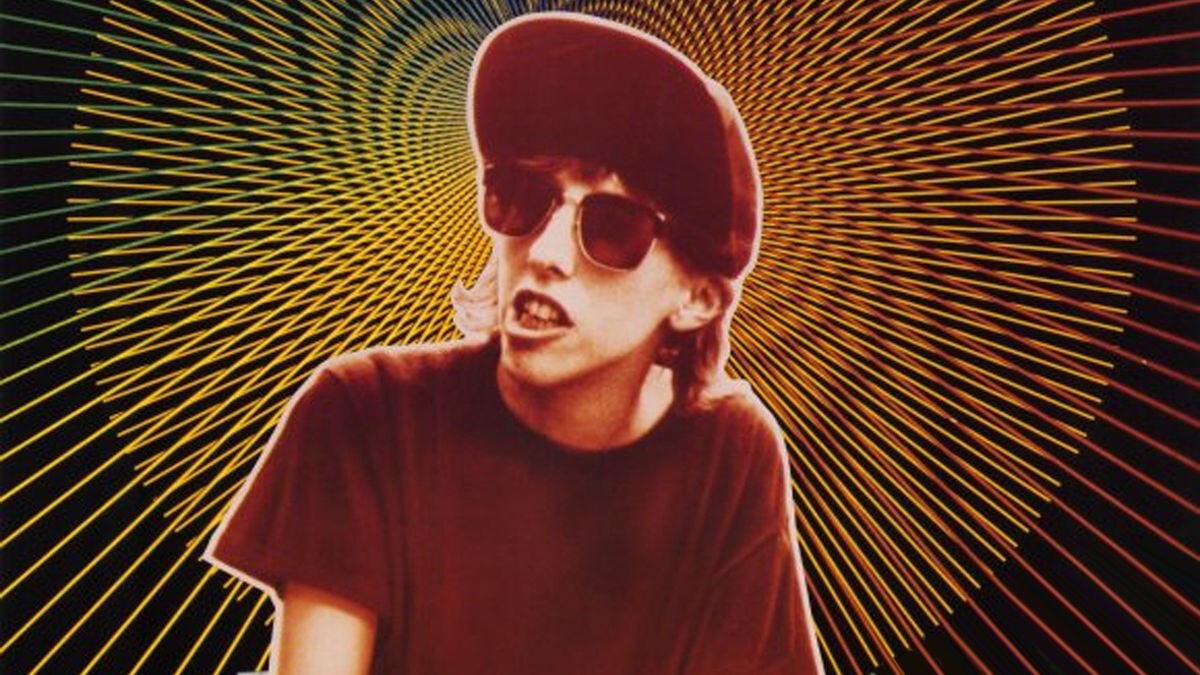 Cover photo-illustration from SLACKER (1991) with Pap Smear Pusher in red duotone & psychedelic rays shooting out her head