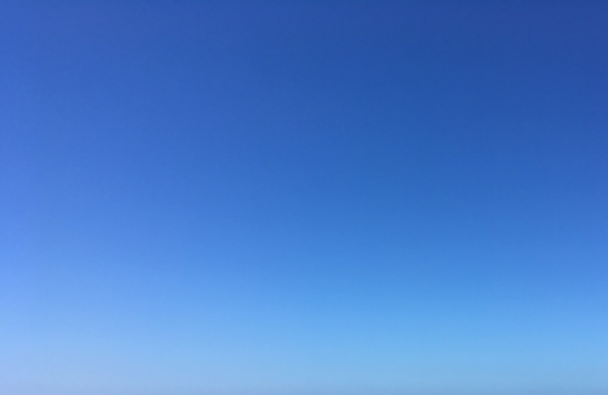 A clear blue sky with no clouds or other objects in it