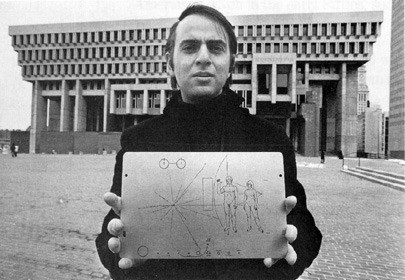Carl Sagan holding the Golden Plaque on voyager