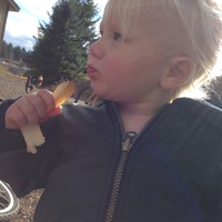 Ada, age 2, eating a french fry at a CCX race