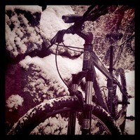 moderate closeup of a mountain bike in the snow