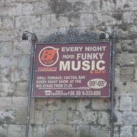 Sign from Hvar Croatia, reads “B7 VIP Terrace. Every night proper funky music & DJ’s! Grill terrace, coctail bar. Every night show at the big stage from 21.00. Open 09.00-05.00. Table reservation +36 30/6-333-000