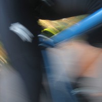 Motion blur closeup of my quads over a racing bicycle