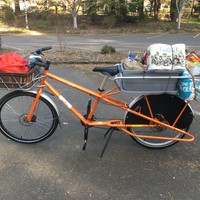 Longtail cargo bike loaded with bags of groceries