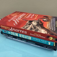Four books in a pile: DISPATCHES FROM ANARRES,  CYCLING REVOLUTION by Patrick Field, ENDLESS LOOP by Mark Jones Lorenzo, and FIRST PERSON SINGULAR by Haruki Murakami