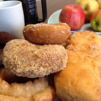Closeup of donuts, apples, and coffee