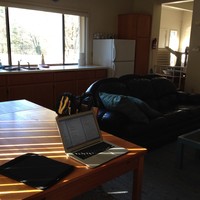 HOA pool house, late fall, afternoon light, my work computer on a table in the foreground