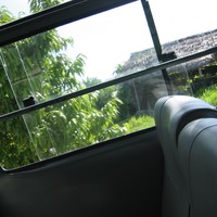 Photo taken out the window of a half-empty bus in Bali