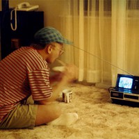 Myself eating cereal in front of a tiny portable TV, taken in 1994