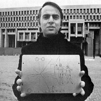 Carl Sagan holding the Golden Plaque on voyager