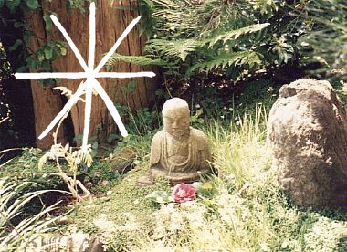 Composite image of a small stone Buddha with a pink flower in front of it, taken at the Japanese garden in San Francisco in 1992; and Vonnegut’s illustration of a asshole.